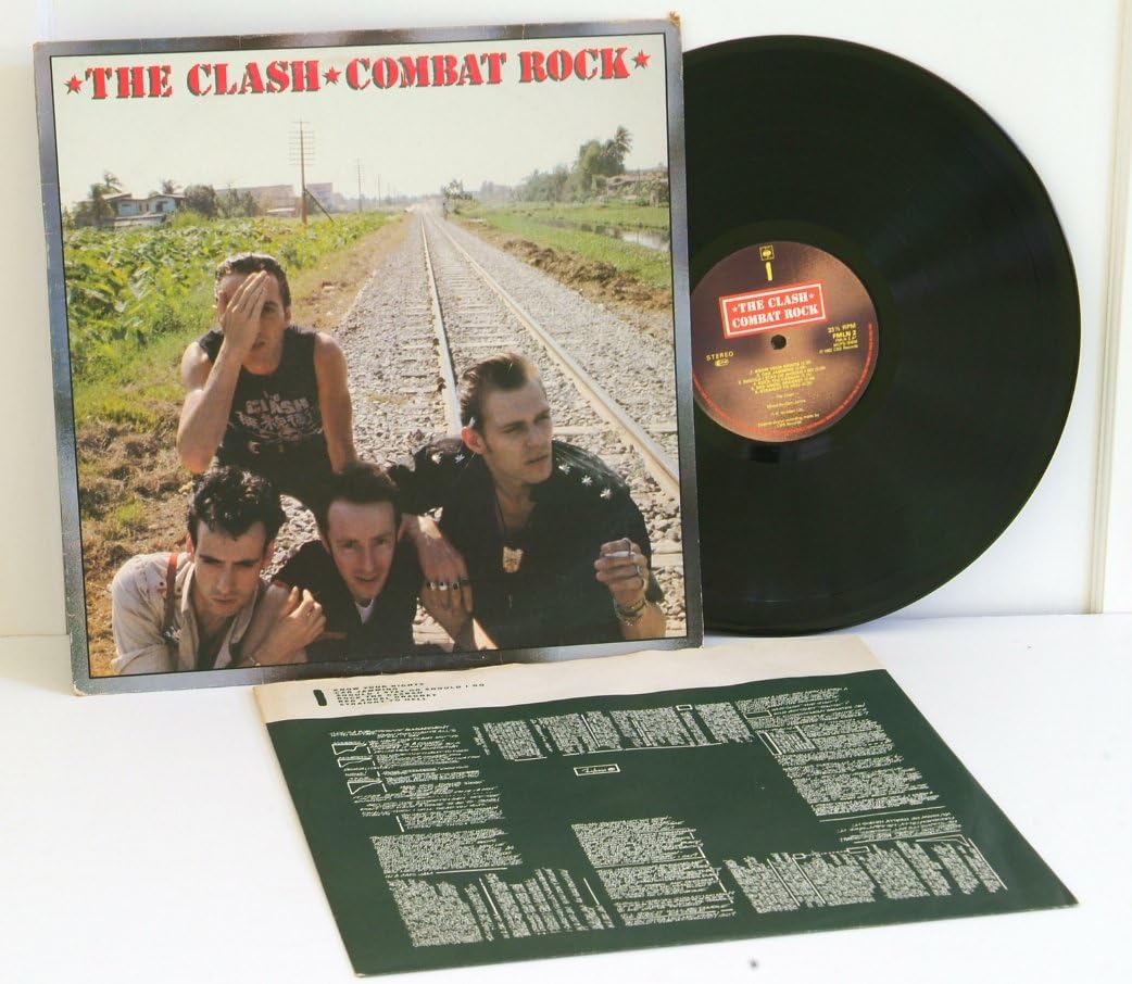 THE CLASH combat rock. First UK pressing 1982, with lyric inner sleeve. CBS records [Vinile] The Clash